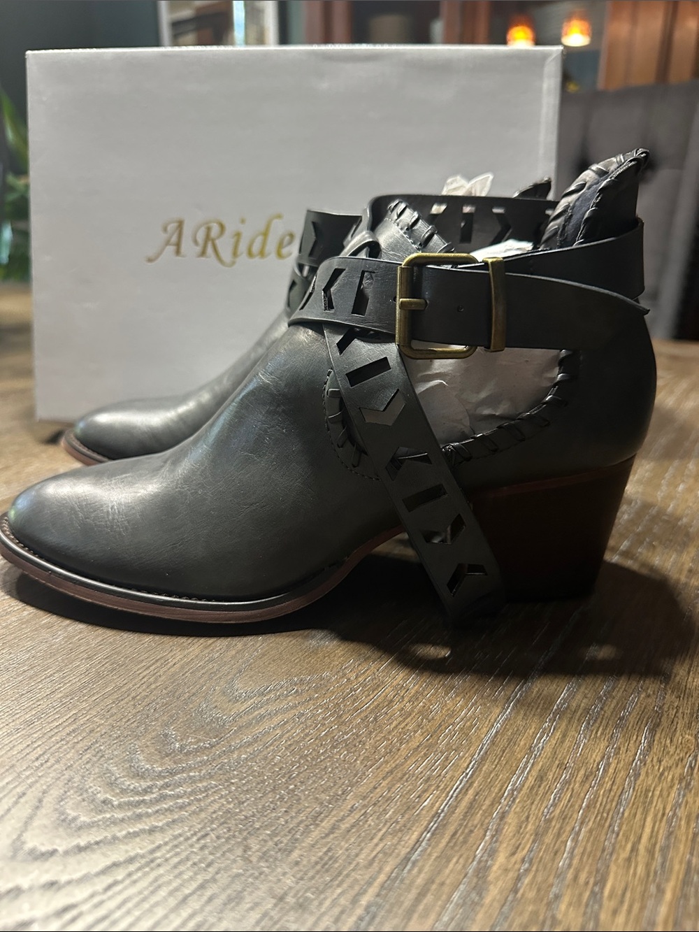 A Rider Girl Leather Cutout Ankle Booties with Buckle Strap